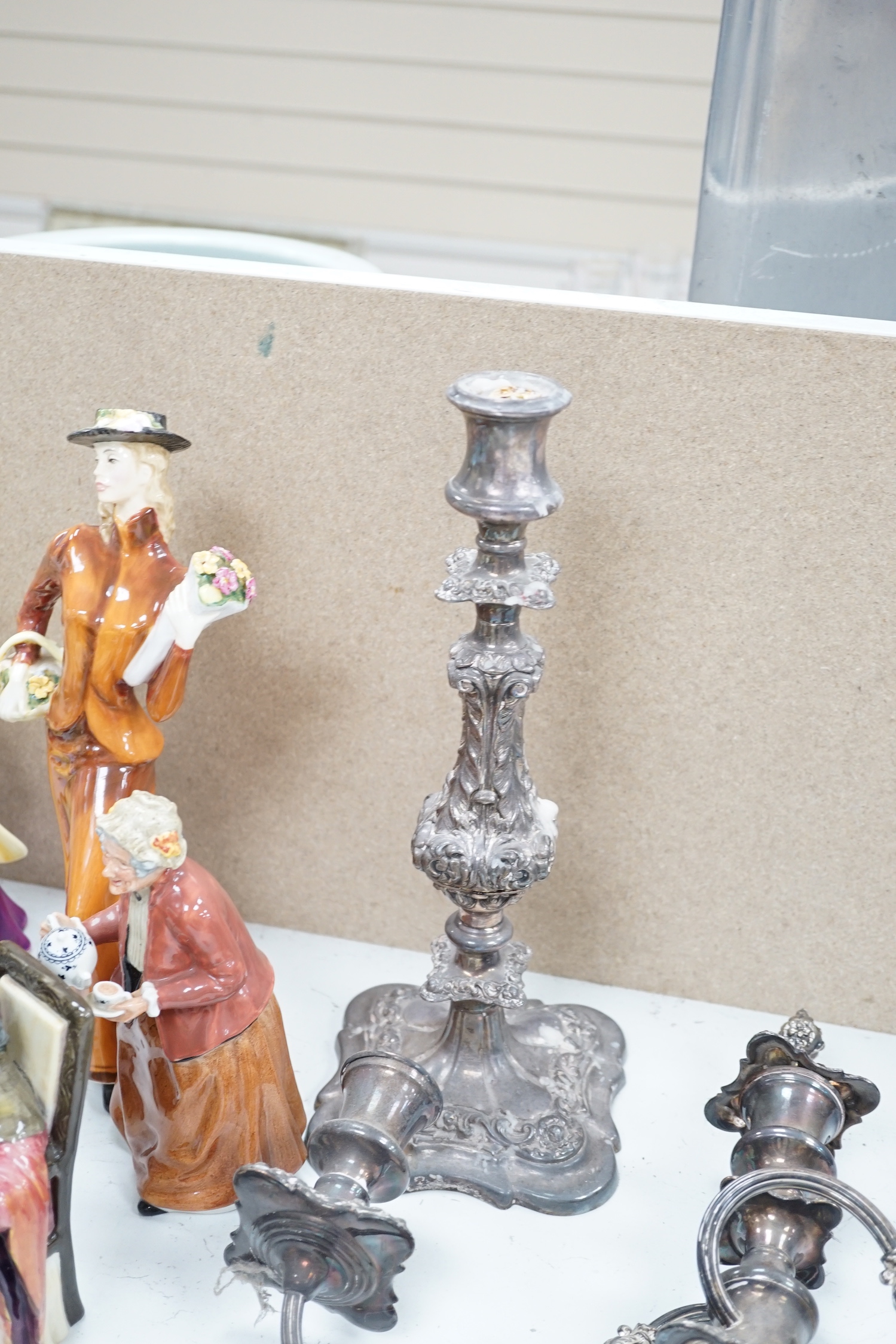 A silver plated entree dish and cover and a pair of three light candelabra, tallest 55cm